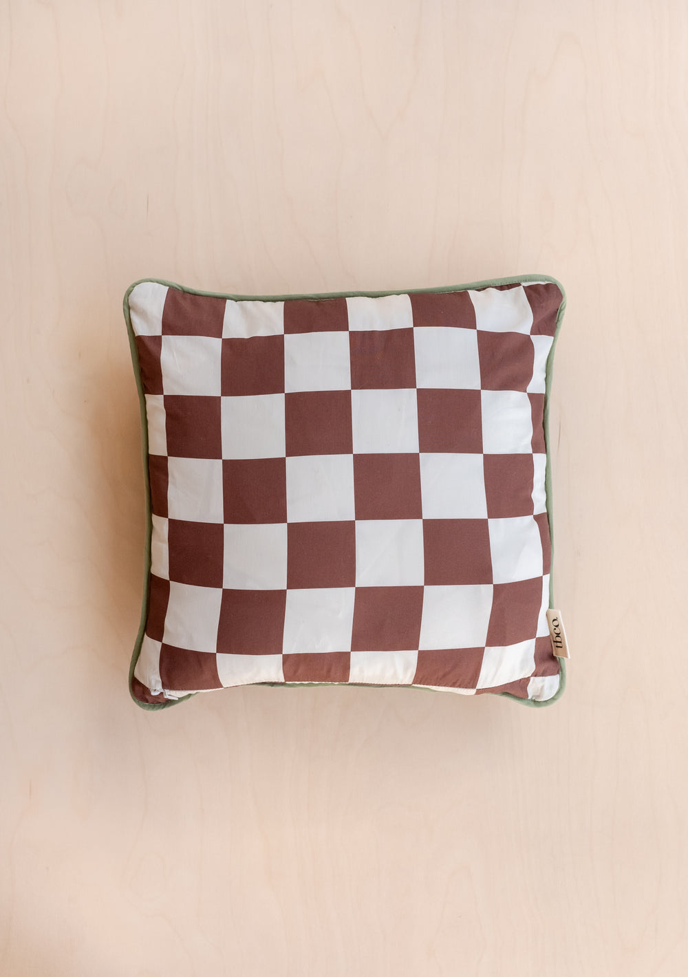 TBCo Reversible Celestial Checkerboard Quilted Cushion Cover with brown and cream checkered pattern and piped edges