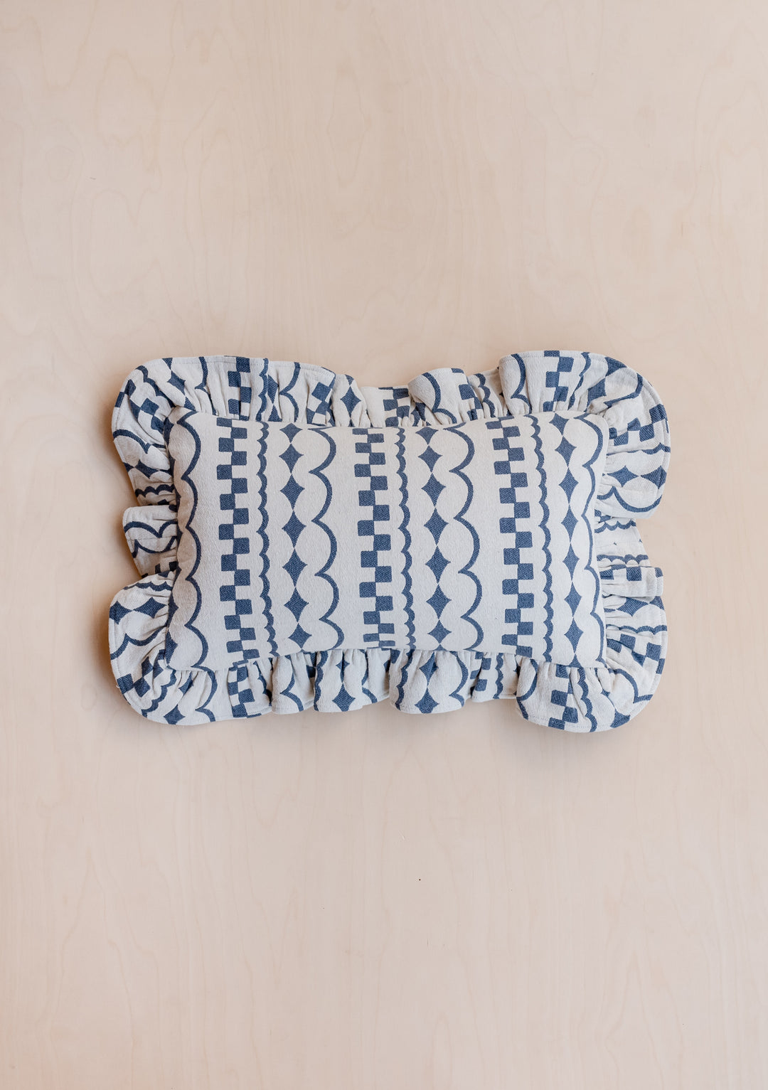 TBCo Cotton Cushion Cover in Navy Ruffle featuring geometric patterns and ruffled edges on cream background