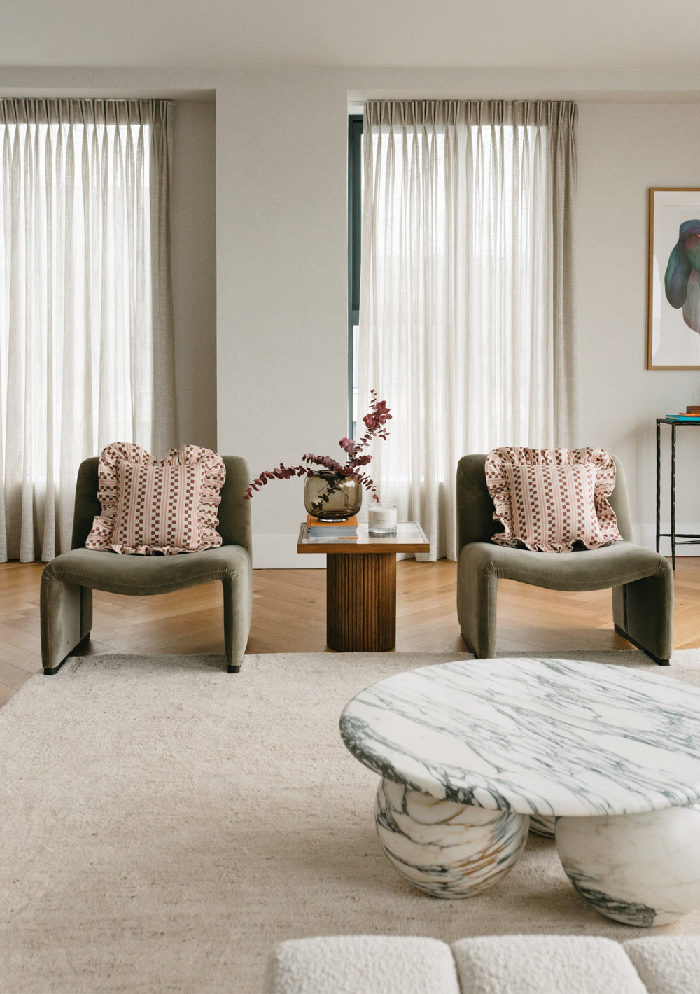 TBCo Cotton Cushion Cover in Pink Stripe styled on grey accent chairs with sheer curtains in modern living room setting