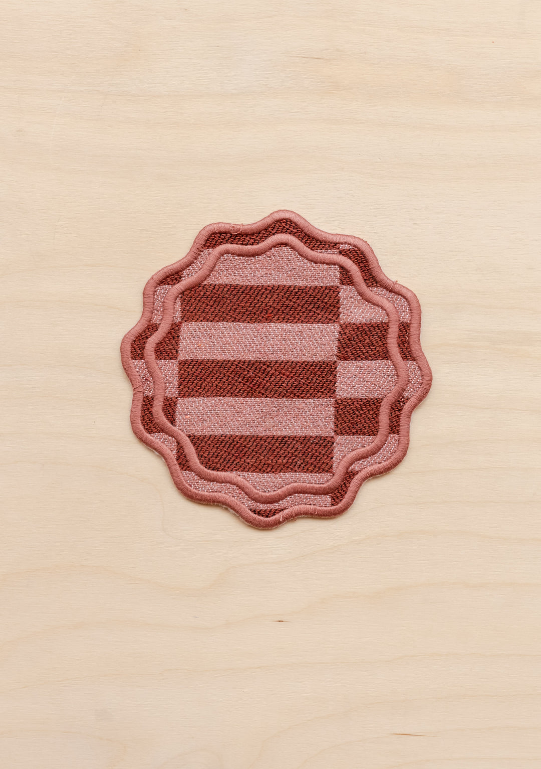 TBCo cotton coasters in Rose checkerboard featuring a soft woven texture design . Designed for stylish and practical table protection, these eco-friendly coasters add warmth and sophistication to any home decor.