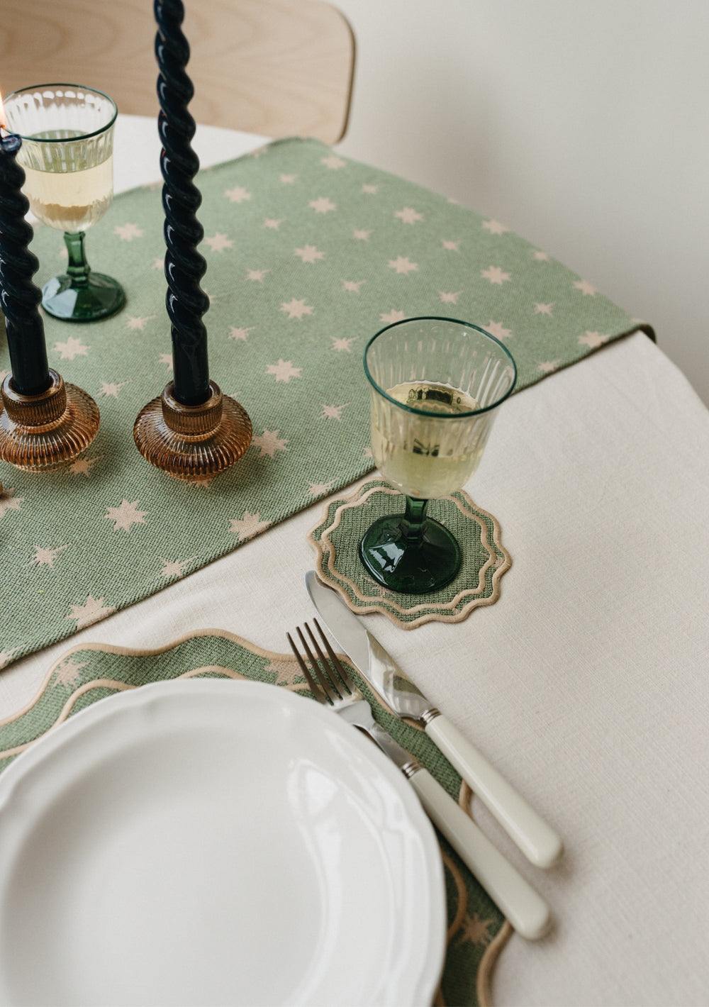 Table setting with TBCo Sage Celestial Coaster and placemats. Sustainable and elegant additions to any table setting, designed for both protection and aesthetic appeal