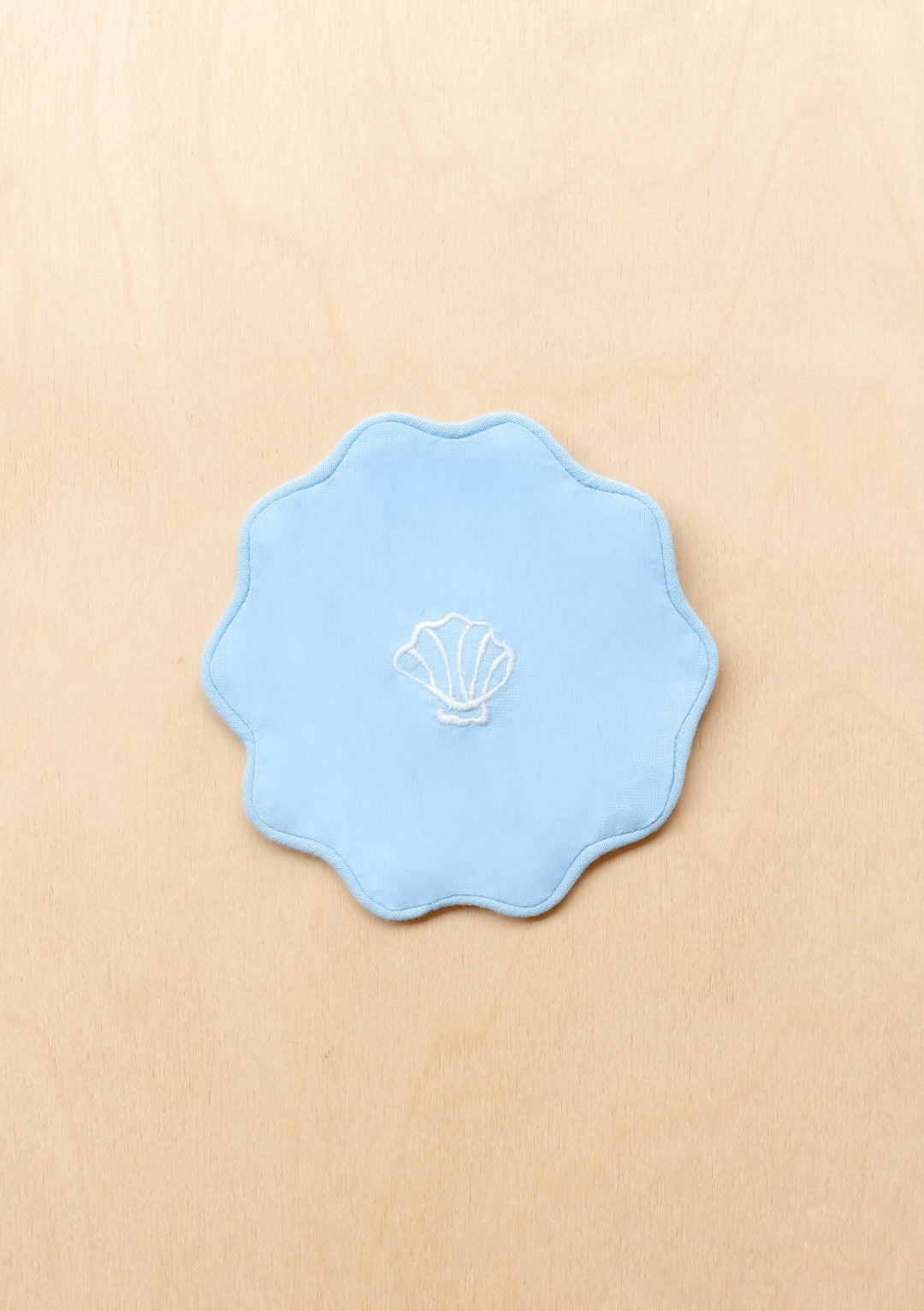 TBCo cotton coasters in blue linen featuring a soft woven texture design . Designed for stylish and practical table protection, these eco-friendly coasters add warmth and sophistication to any home decor.