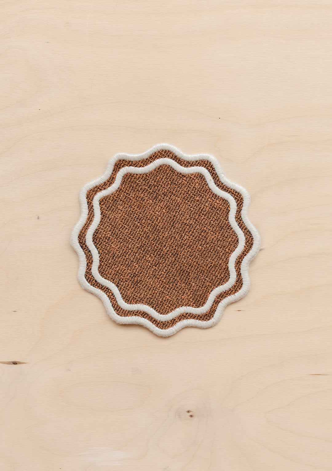 TBCo cotton coasters in camel featuring a soft woven texture design . Designed for stylish and practical table protection, these eco-friendly coasters add warmth and sophistication to any home decor.