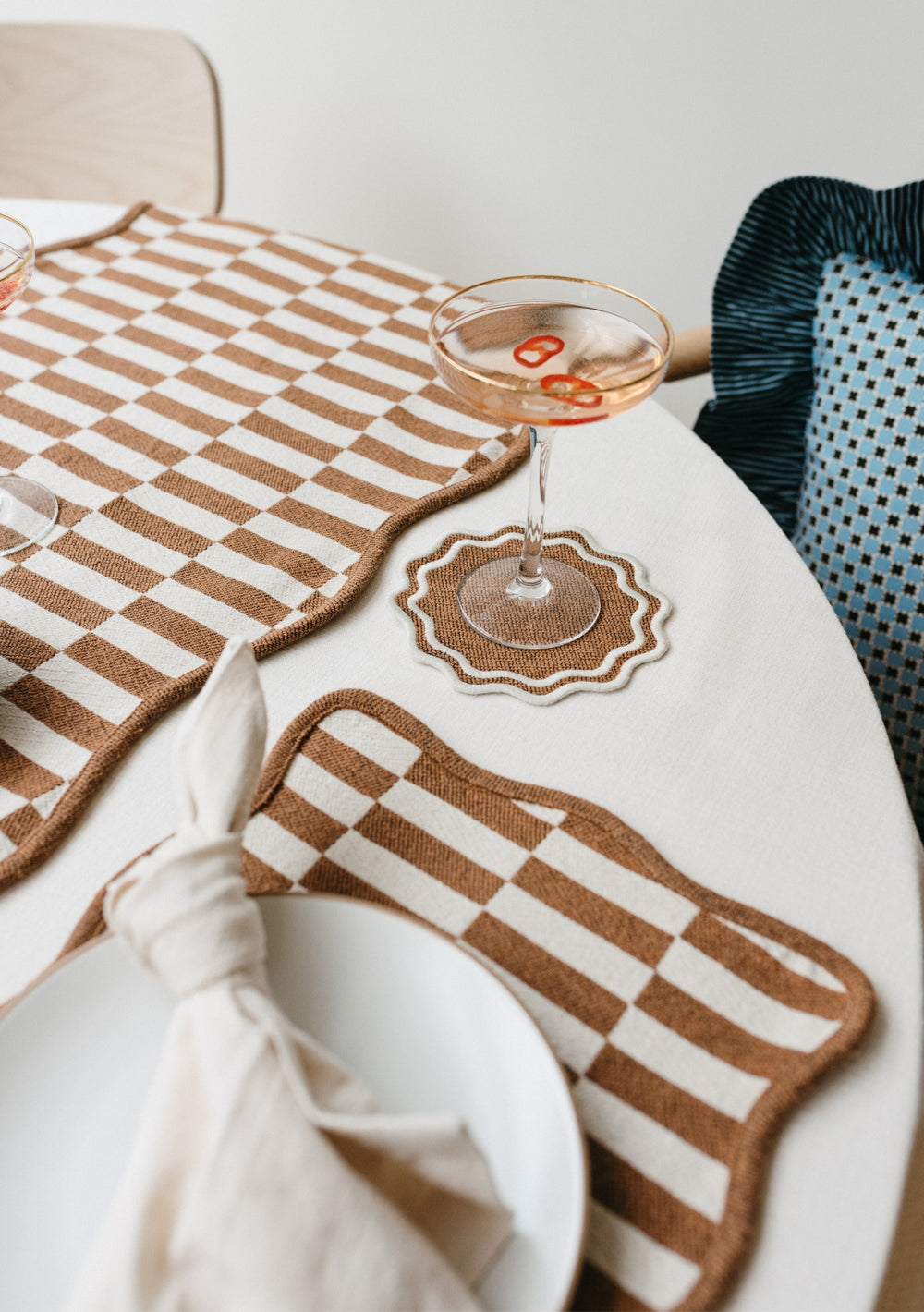 Table setting with TBCo Camel Coaster and placemats. Sustainable and elegant additions to any table setting, designed for both protection and aesthetic appeal