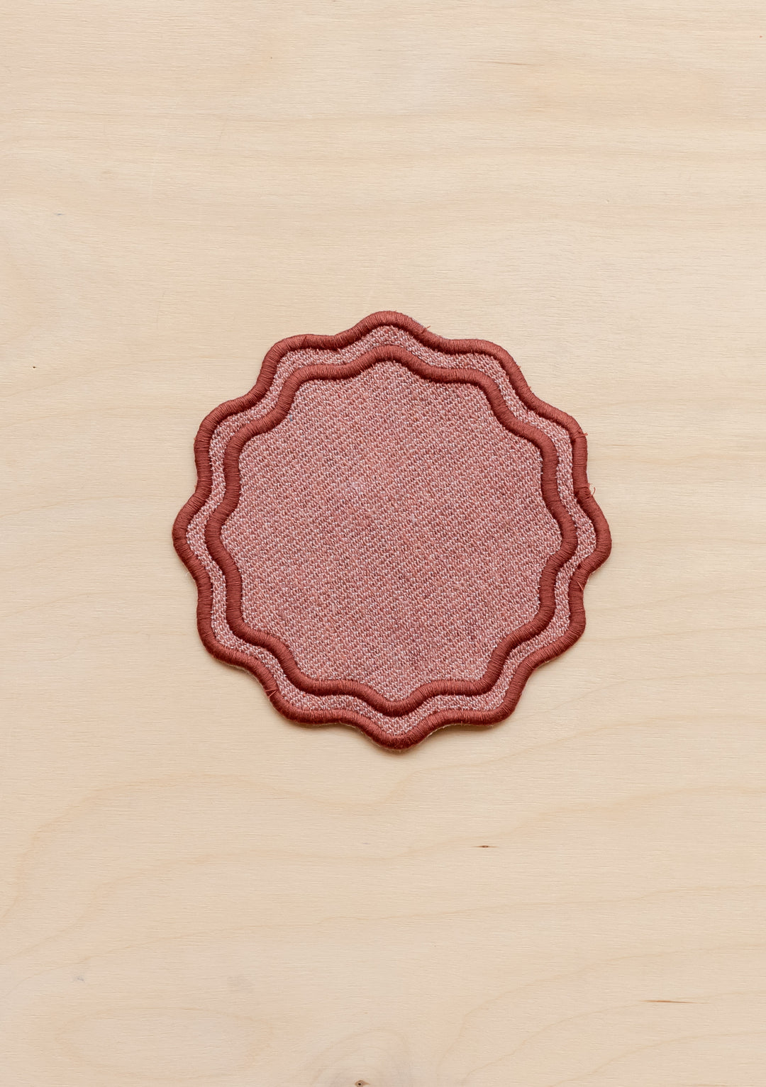 TBCo cotton coasters in rose featuring a soft woven texture design . Designed for stylish and practical table protection, these eco-friendly coasters add warmth and sophistication to any home decor.