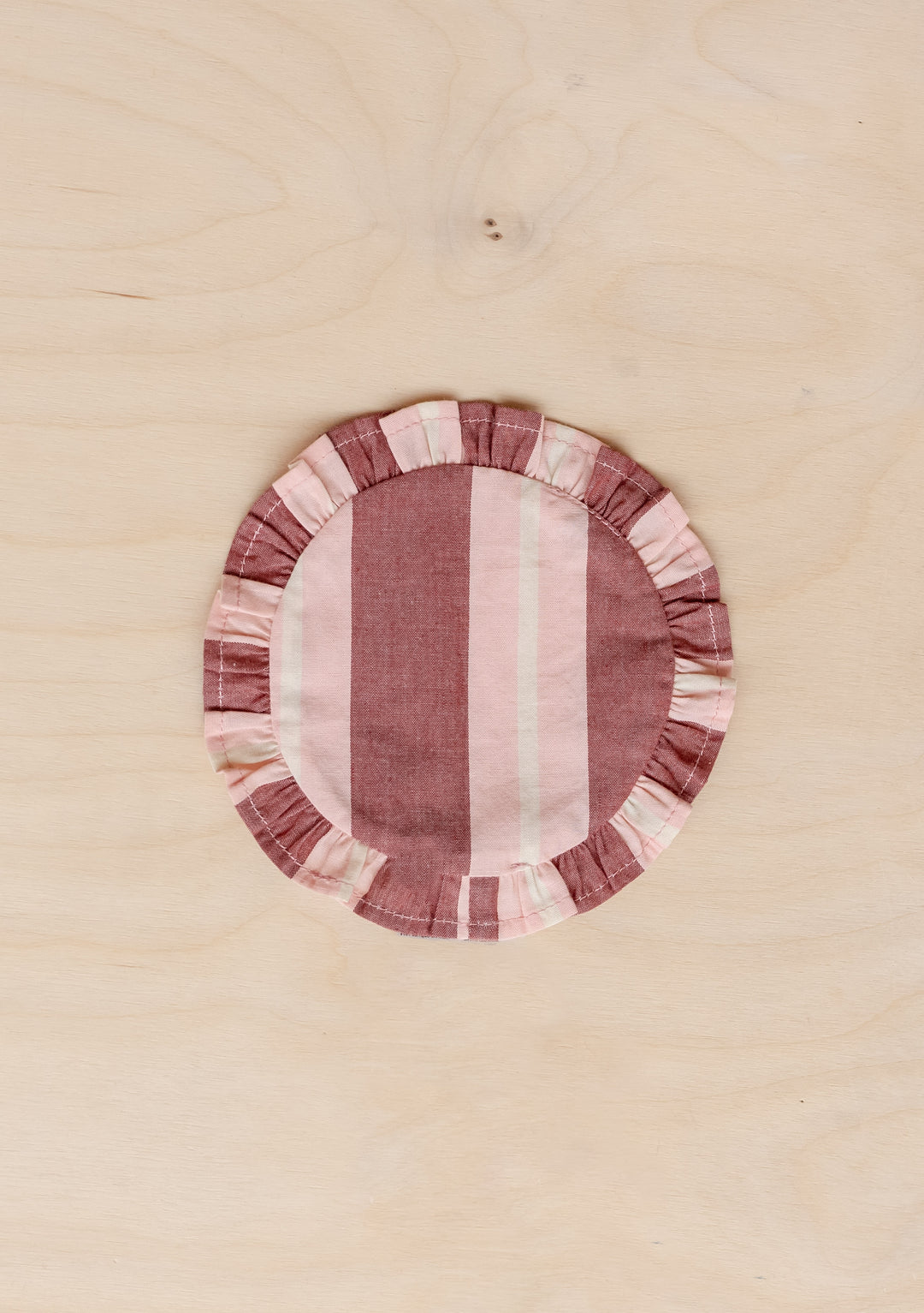 TBCo cotton coasters in red stripe featuring a soft woven texture design. Designed for stylish and practical table protection, these eco-friendly coasters add warmth and sophistication to any home decor.