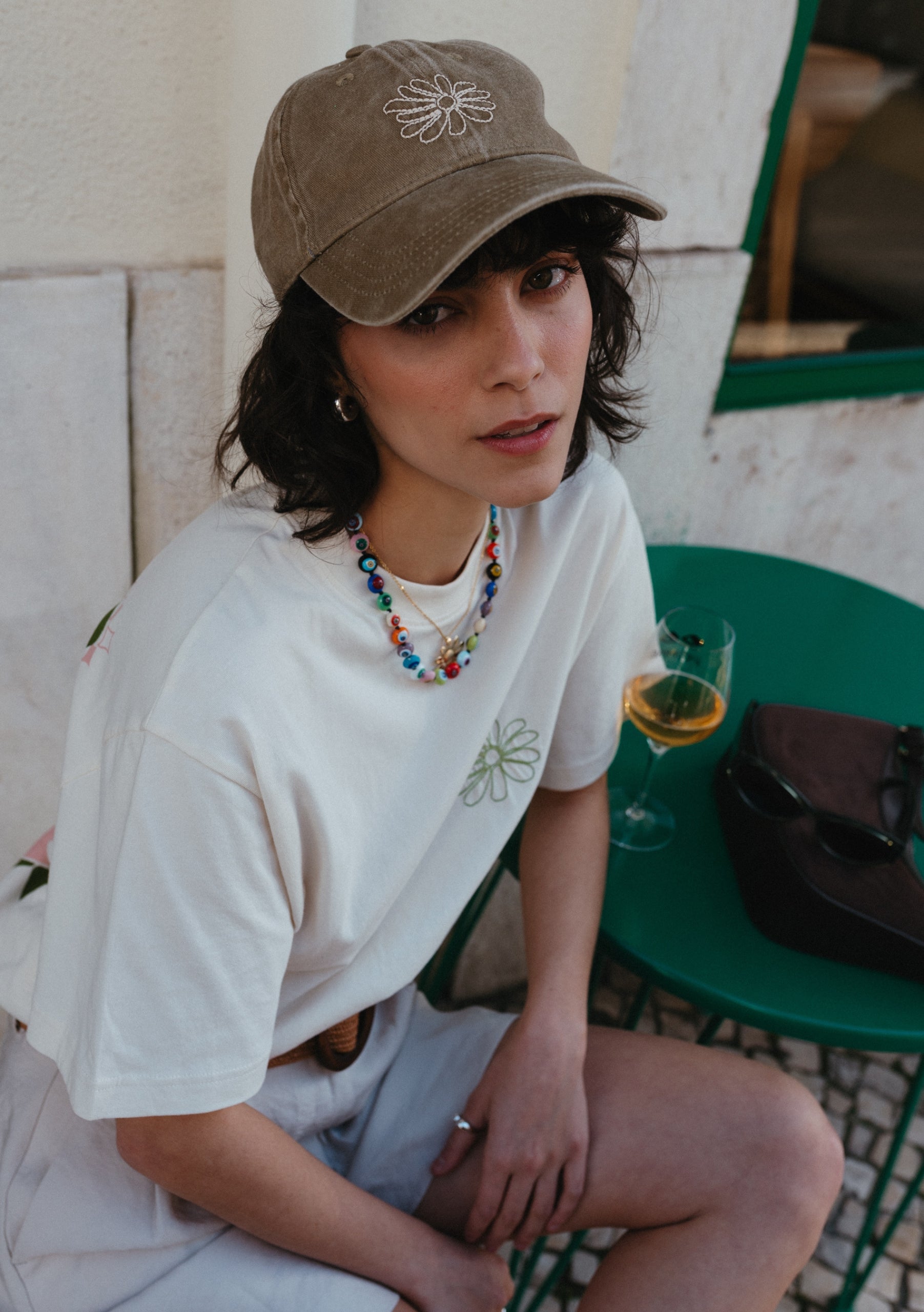 TBCo Recycled Cotton Cap in Flora with embroidered daisy design, adjustable brown cotton cap with floral detail