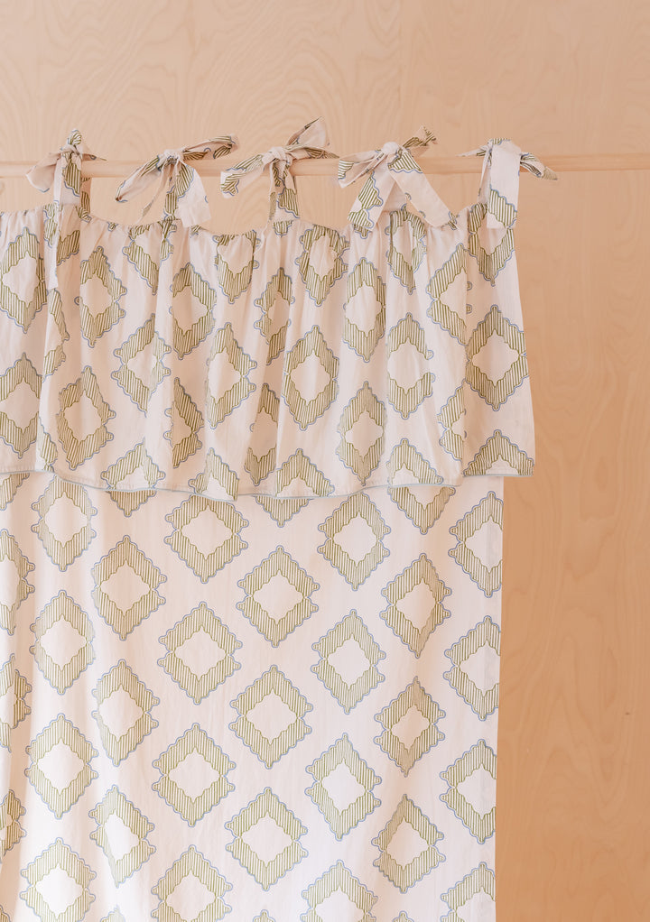 Pair of Cotton Tie-Top Curtains in Green Diamond by TBCo, featuring delicate green diamond print with tie-top fastening detail