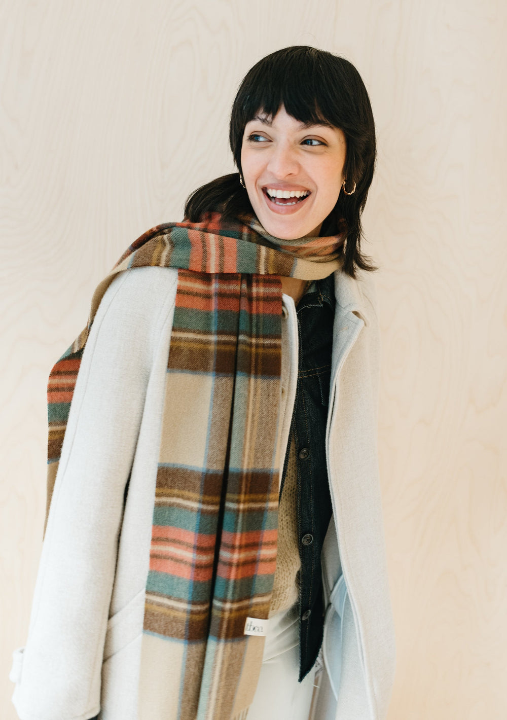 TBCo Stewart Dress Antique Tartan cashmere scarf draped elegantly, showcasing traditional plaid pattern in camel, brown, green and red