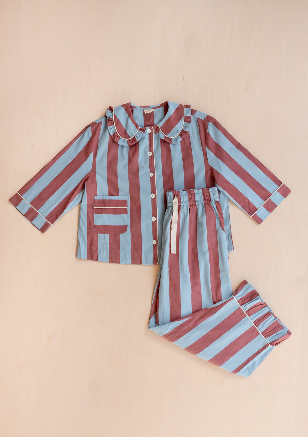 TBCo Cotton Pyjamas in blue and burgundy stripes with ruffled collar and button-front top with matching drawstring trousers