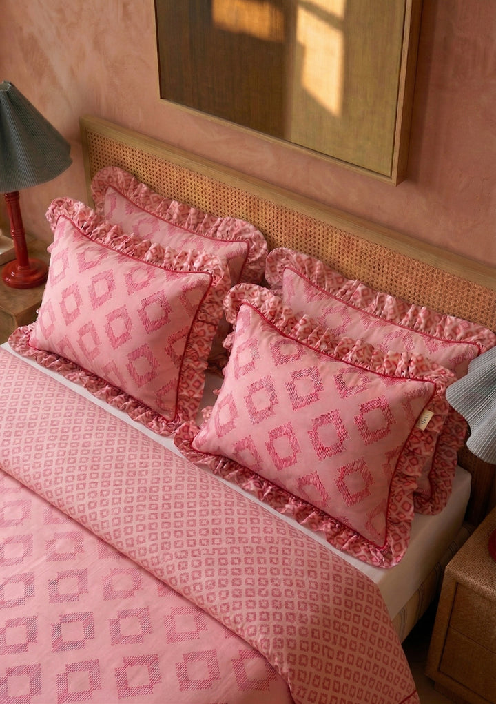 TBCo Cotton Duvet Cover & Pillowcases Set in Pink Diamond featuring ruffled edges and a geometric pattern on soft cotton fabric
