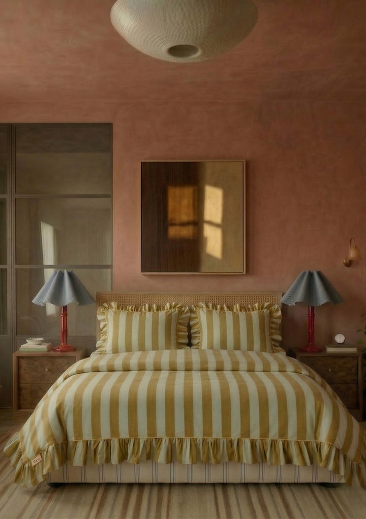 Cozy bedroom outfitted with TBCo Cotton Duvet Cover & Pillowcases Set in Mint Stripe featuring soft ruffles and wide striped design