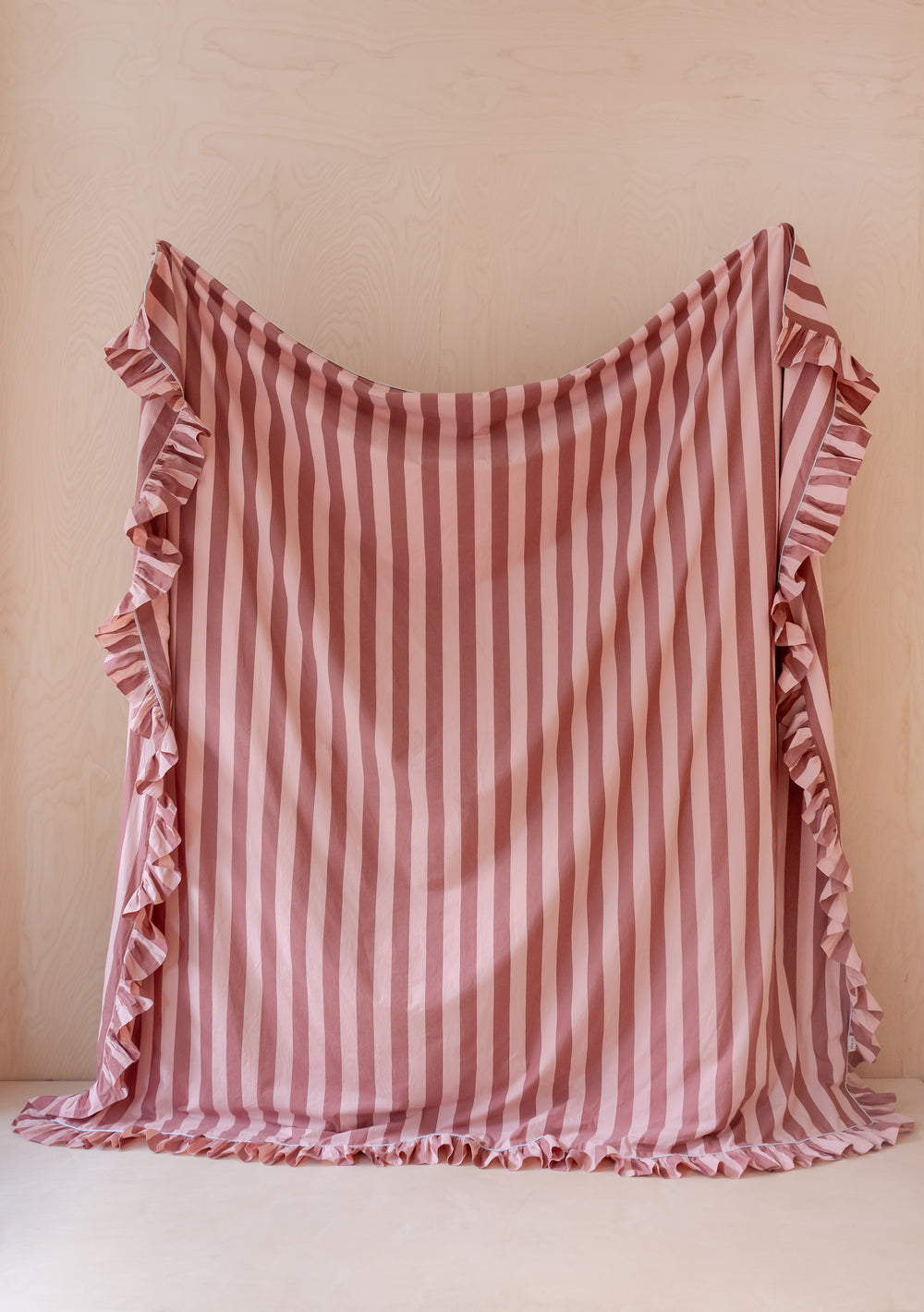 TBCo Cotton Duvet Cover with pink and burgundy stripes, featuring ruffled edges displayed against beige background