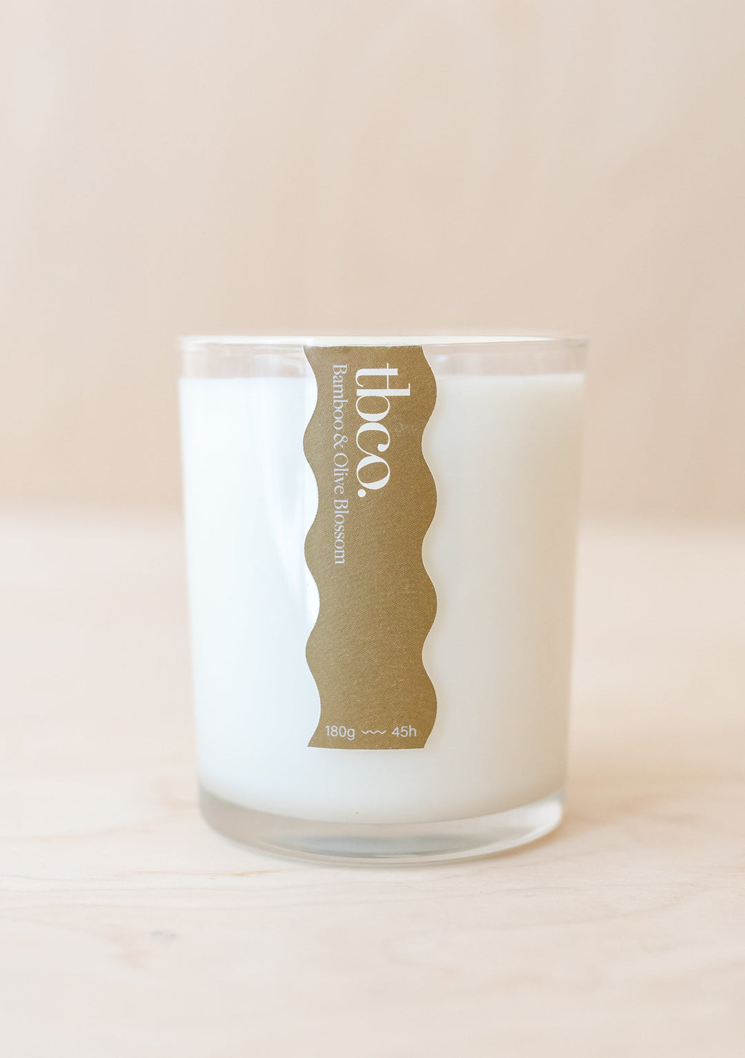 TBCo Bamboo & Olive Blossom luxury soy candle in recycled glass vessel with gold wavy label, 180g natural fragrance candle