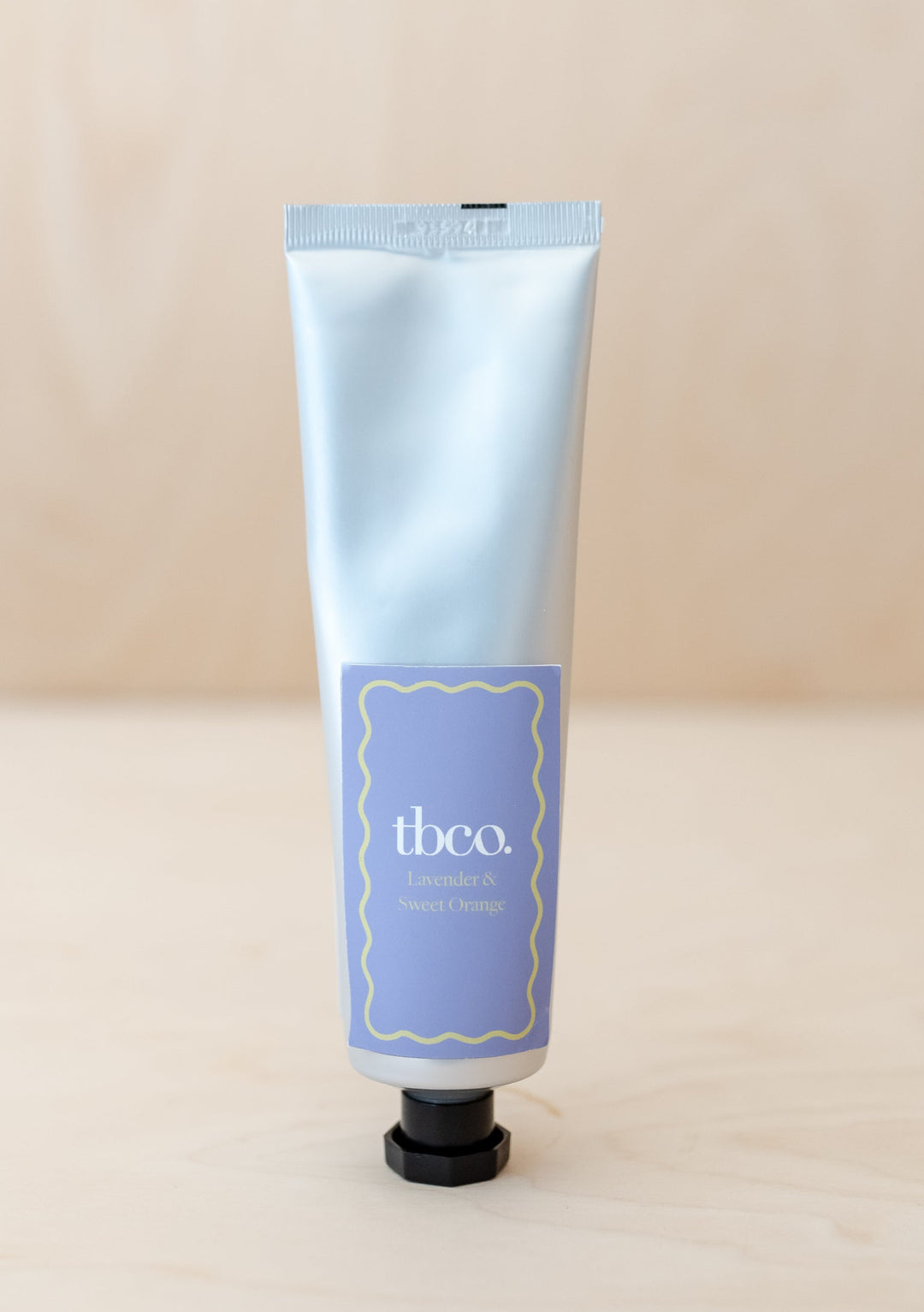 TBCo Lavender & Sweet Orange Hand Cream in white tube with lavender label, featuring natural moisturising ingredients