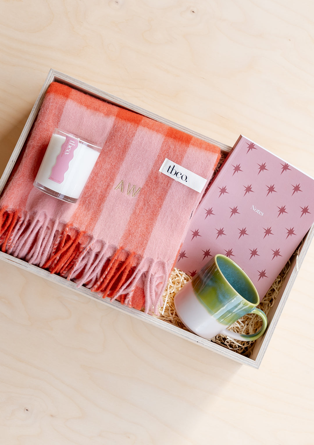 TBCo Gift Box For Her featuring coral striped scarf, decorative mug and candle arranged in custom presentation box