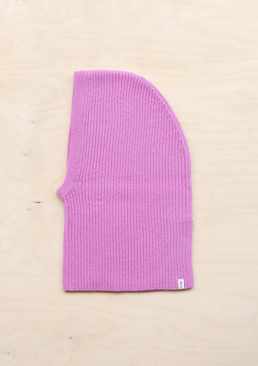 Pink ribbed merino wool kids hood by TBCo, featuring soft knit texture and cosy winter warmth design