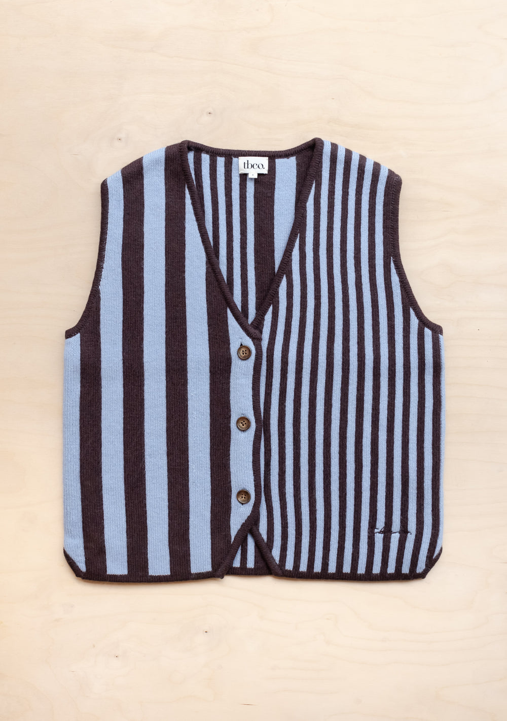 TBCo Merino Wool Vest in blue and brown stripes featuring V-neck design and button-front closure, crafted from pure merino wool