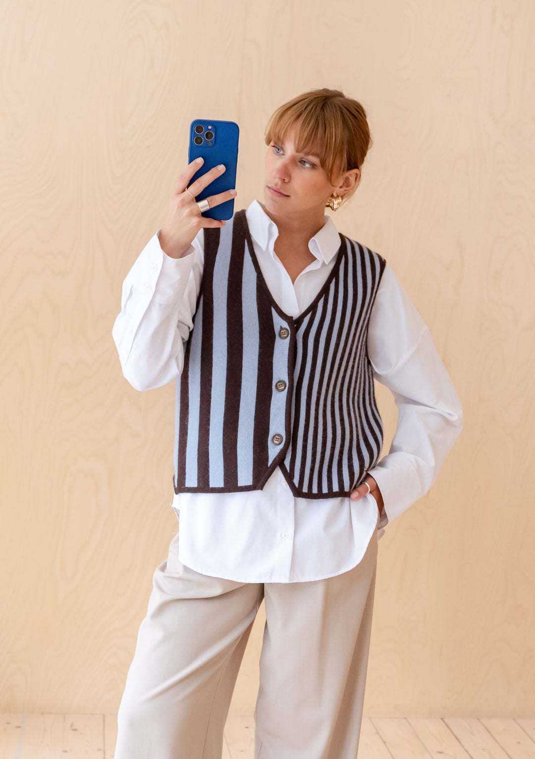 TBCo Merino Wool Vest in Blue Stripe shown with V-neck design, brown and blue vertical stripes pattern, worn over white shirt