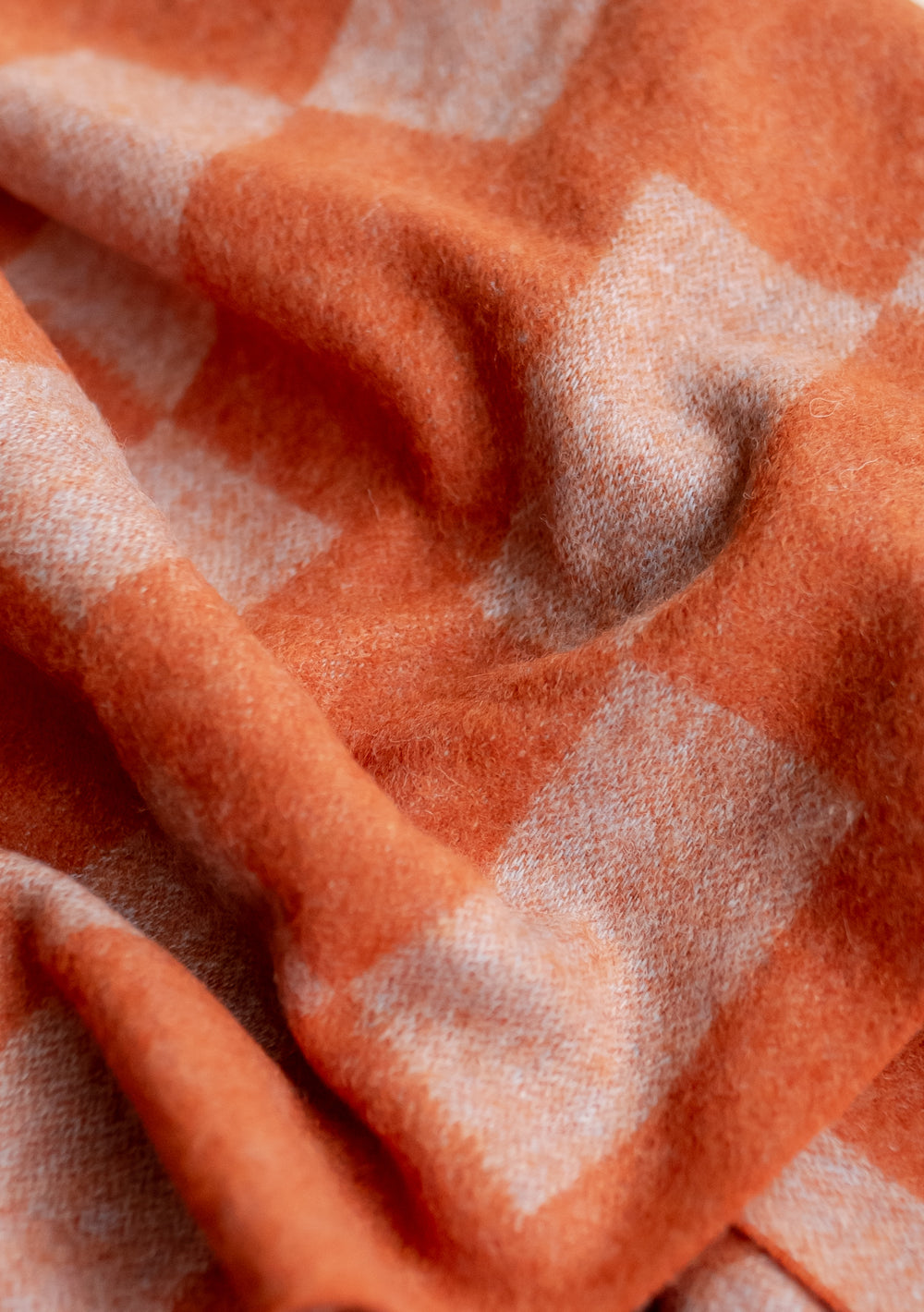 TBCo Lambswool Kids Scarf in Orange Checker pattern, close-up view showing soft woven texture and vibrant colour detail