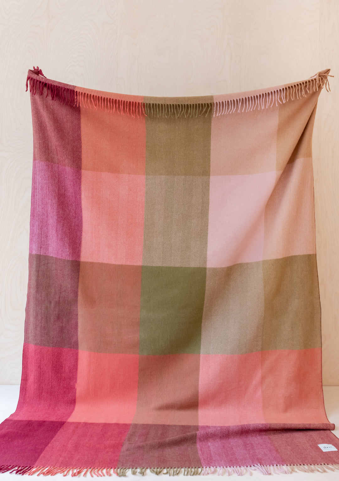 TBCo Recycled Wool Extra Large Blanket in pink and brown herringbone check pattern with fringed edges displayed flat