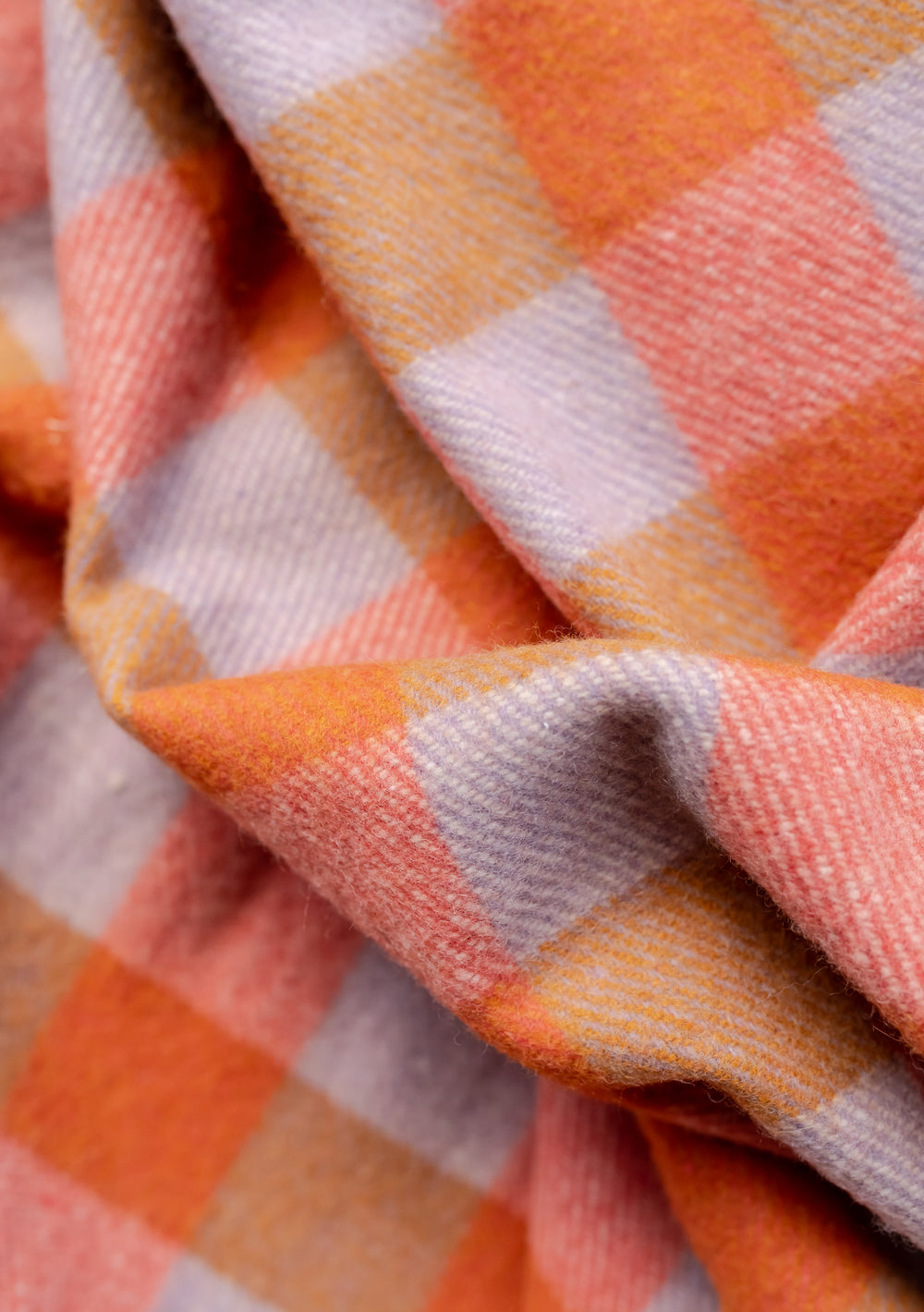 TBCo Recycled Wool Extra Large Blanket in orange, lavender and grey gingham pattern with fringed edges showing textured weave detail