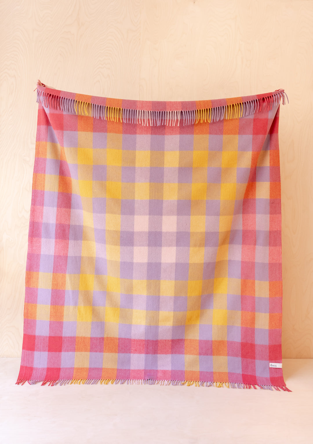 TBCo Recycled Wool Blanket in Lilac Gradient Gingham featuring pink, yellow and lilac checks with fringed edges on cream background