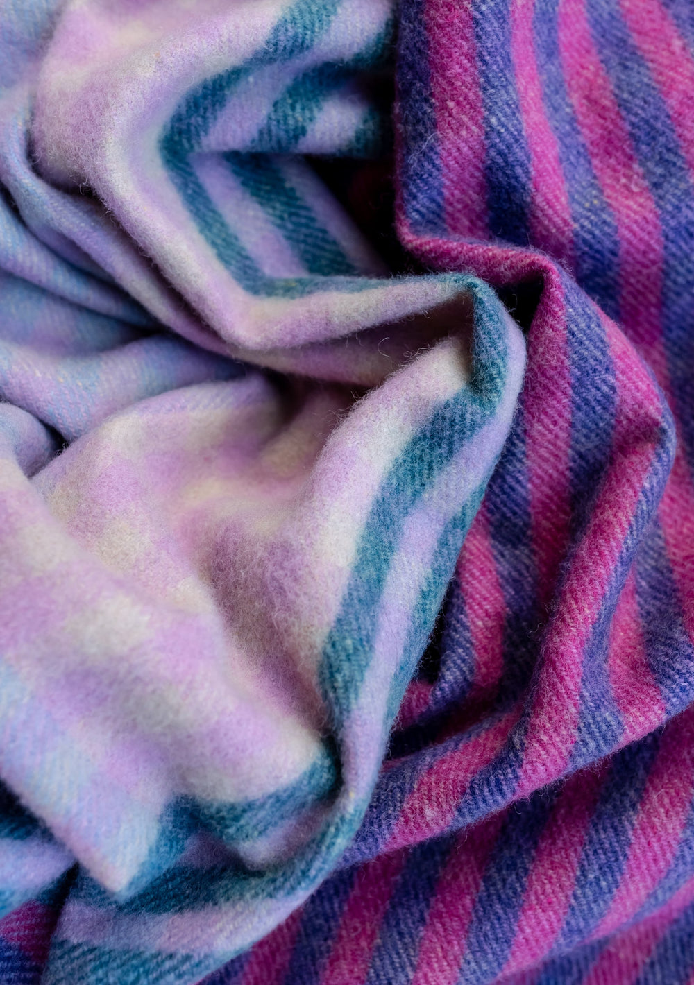 Close-up texture of TBCo Recycled Wool Blanket in Lavender Micro Gingham showing soft folds and vibrant purple and blue stripes