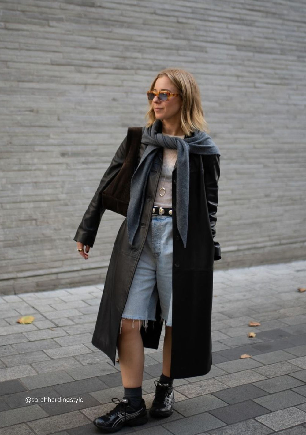 TBCo Large Merino Triangle Scarf in charcoal styled elegantly with black winter coat and denim, showcasing versatile draping