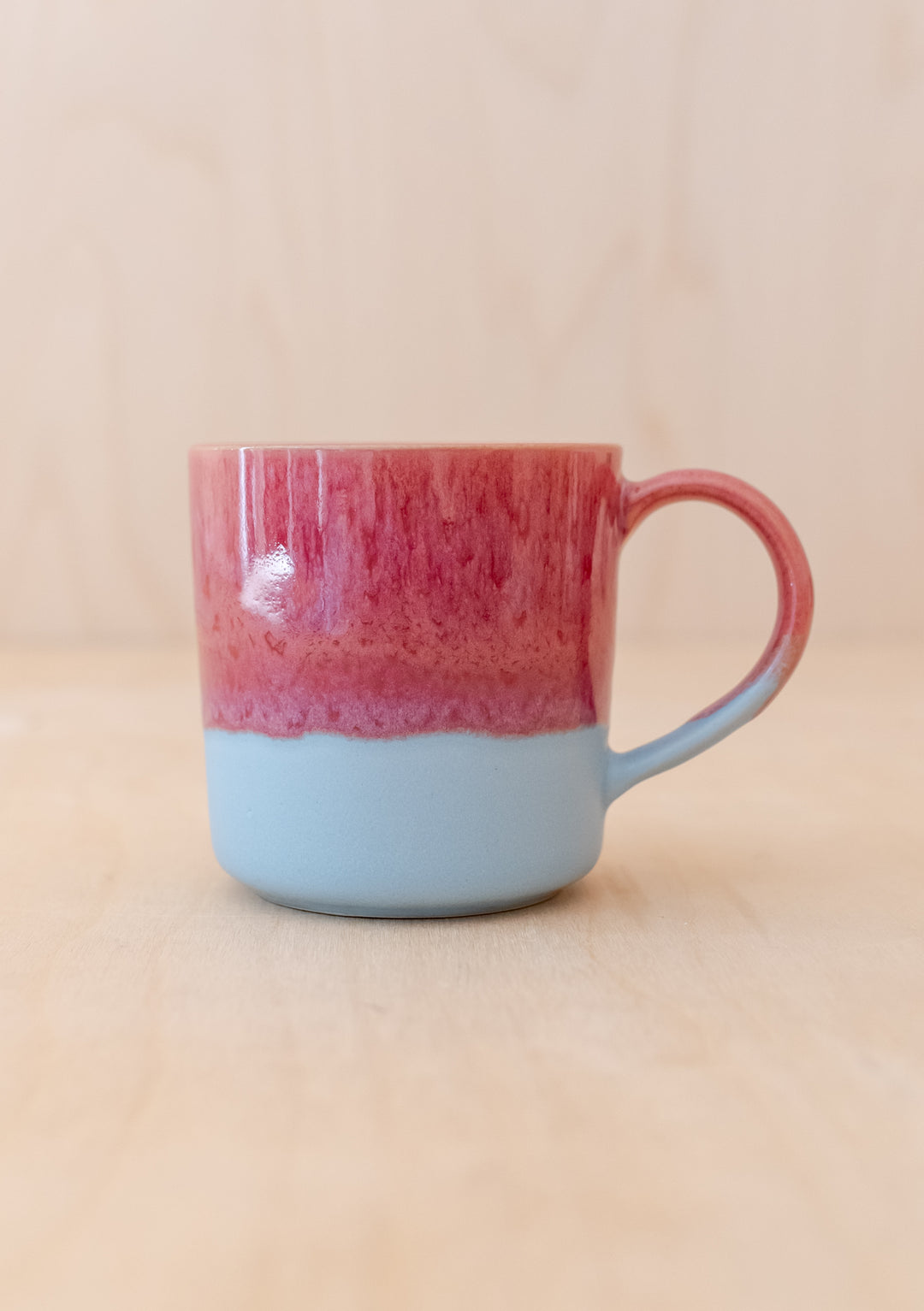 Handcrafted TBCo Red Dip Mug featuring a unique two-tone design with red glazed top and grey ceramic base, perfect for your morning brew