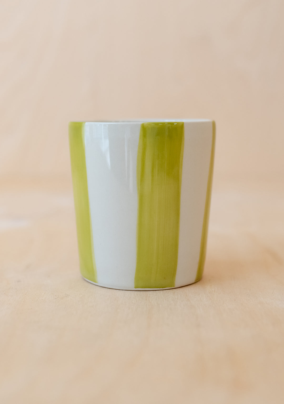 Handcrafted TBCo Green Stripe Mug featuring vertical green and white stripes on a handleless ceramic design, perfect for your favourite brew