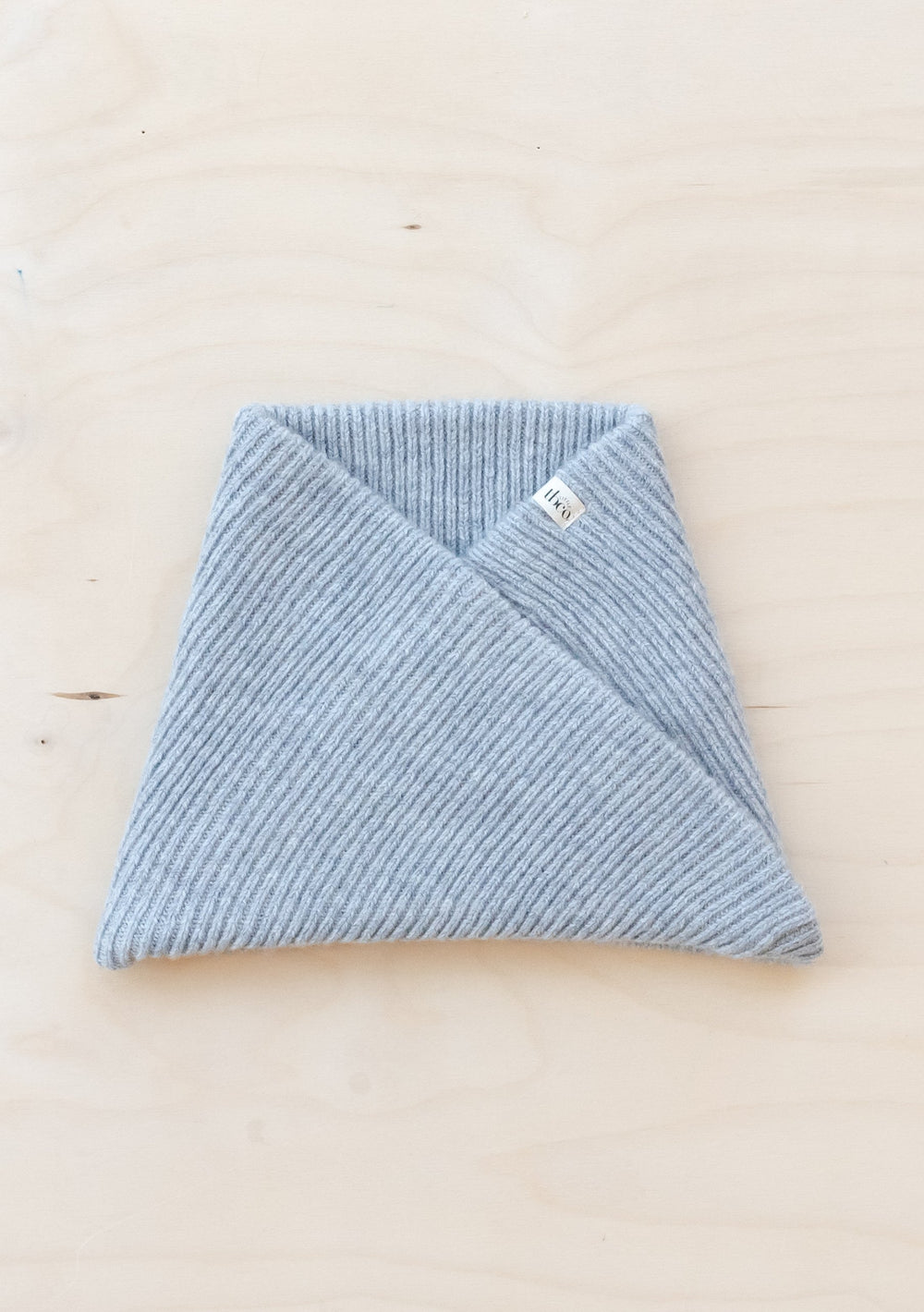 Light grey melange ribbed merino wool kids neck warmer by TBCo displayed flat showing wrap-around design and cosy texture