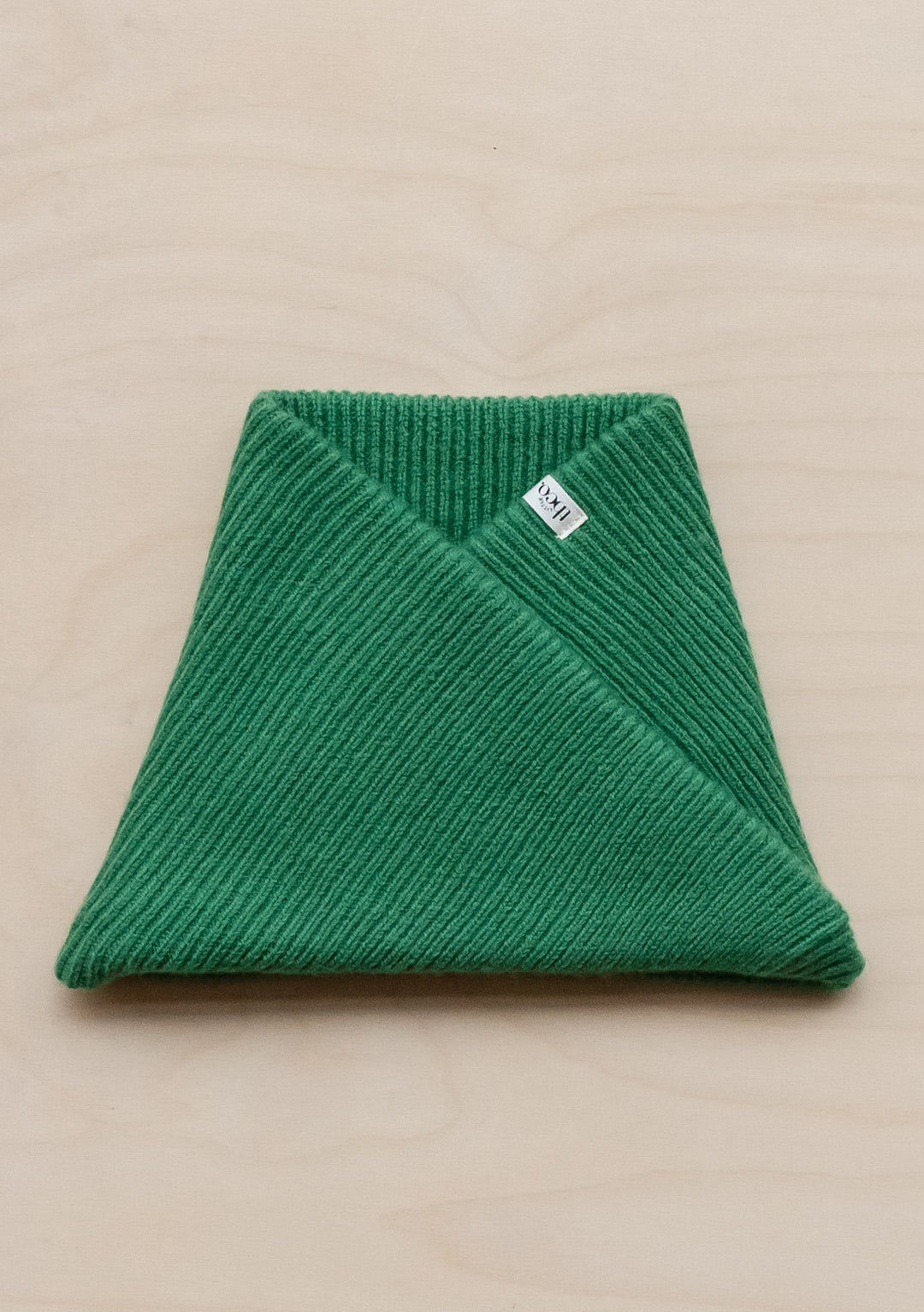 Green ribbed merino wool kids neck warmer by TBCo, folded to show knit texture and slip-on design