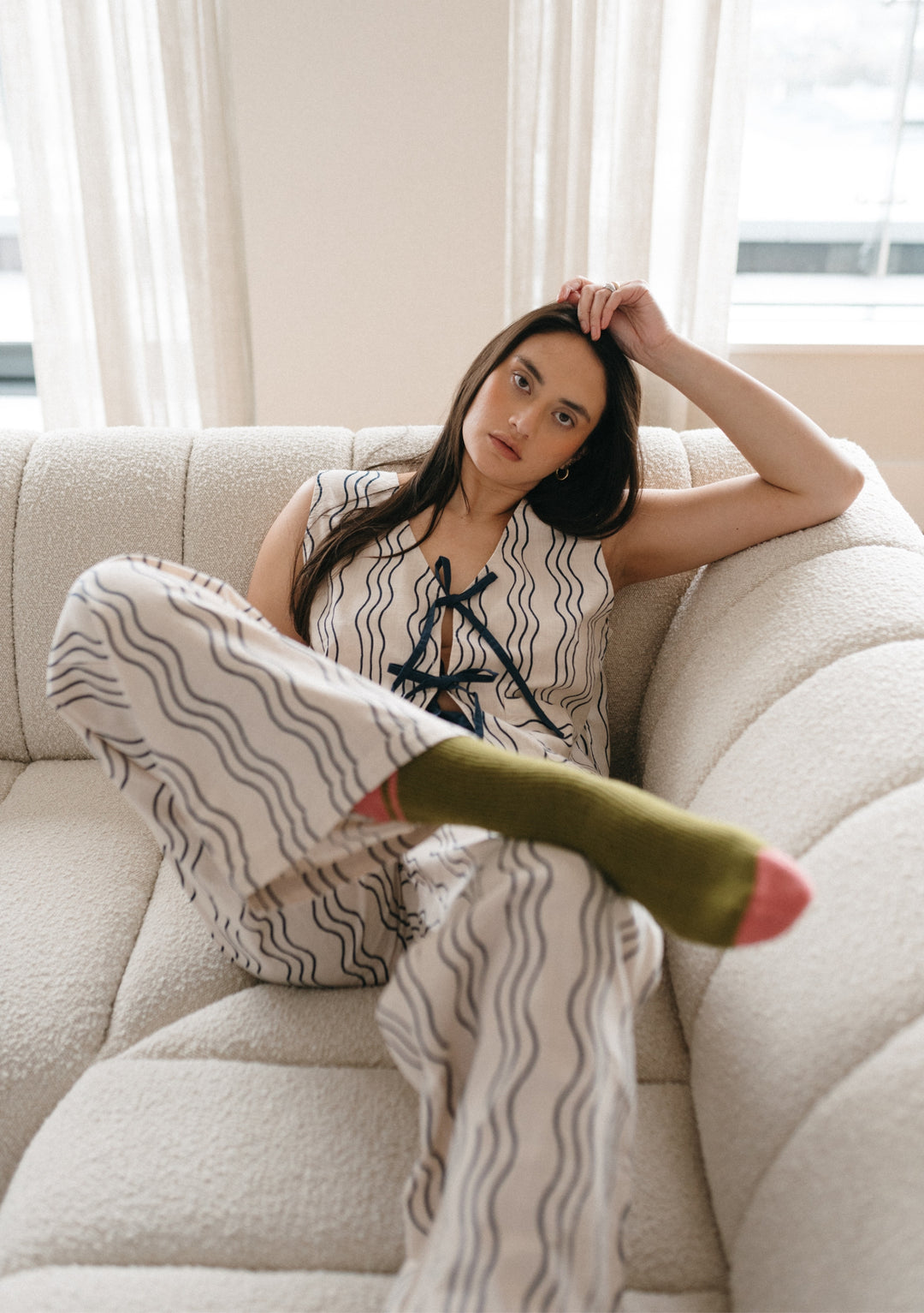 TBCo Cotton Tie Set in Blue Wave pattern loungewear displayed on cream sofa, showing wavy print design and tie detail