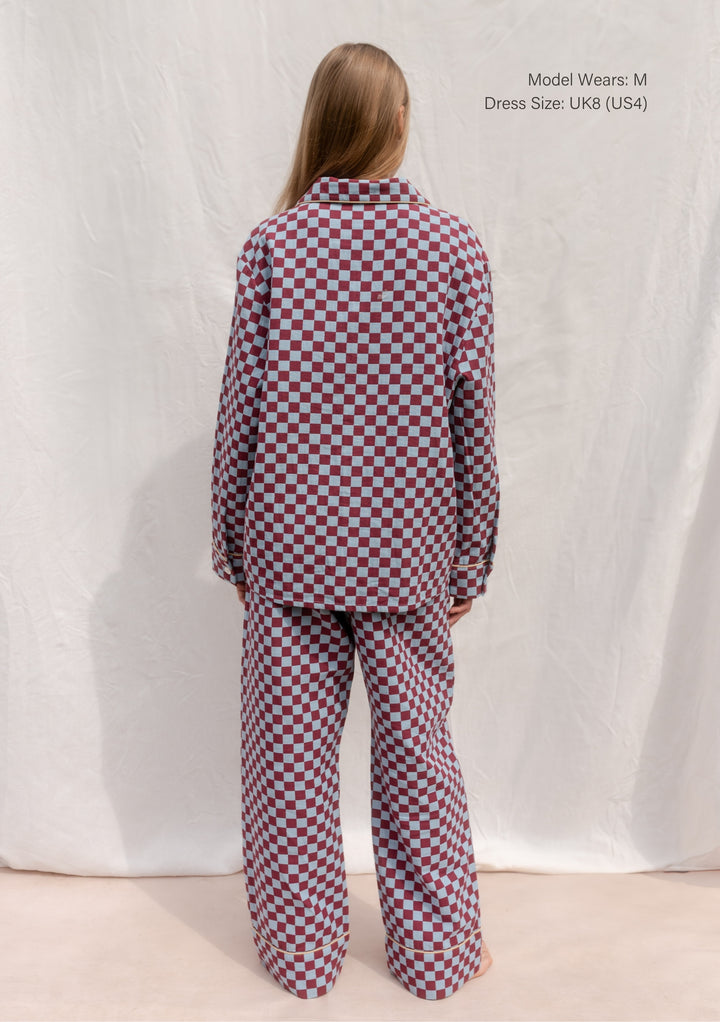 Back view of TBCo Cotton Pyjamas in Blue Checkerboard featuring breathable cotton and elastic waistband comfort.