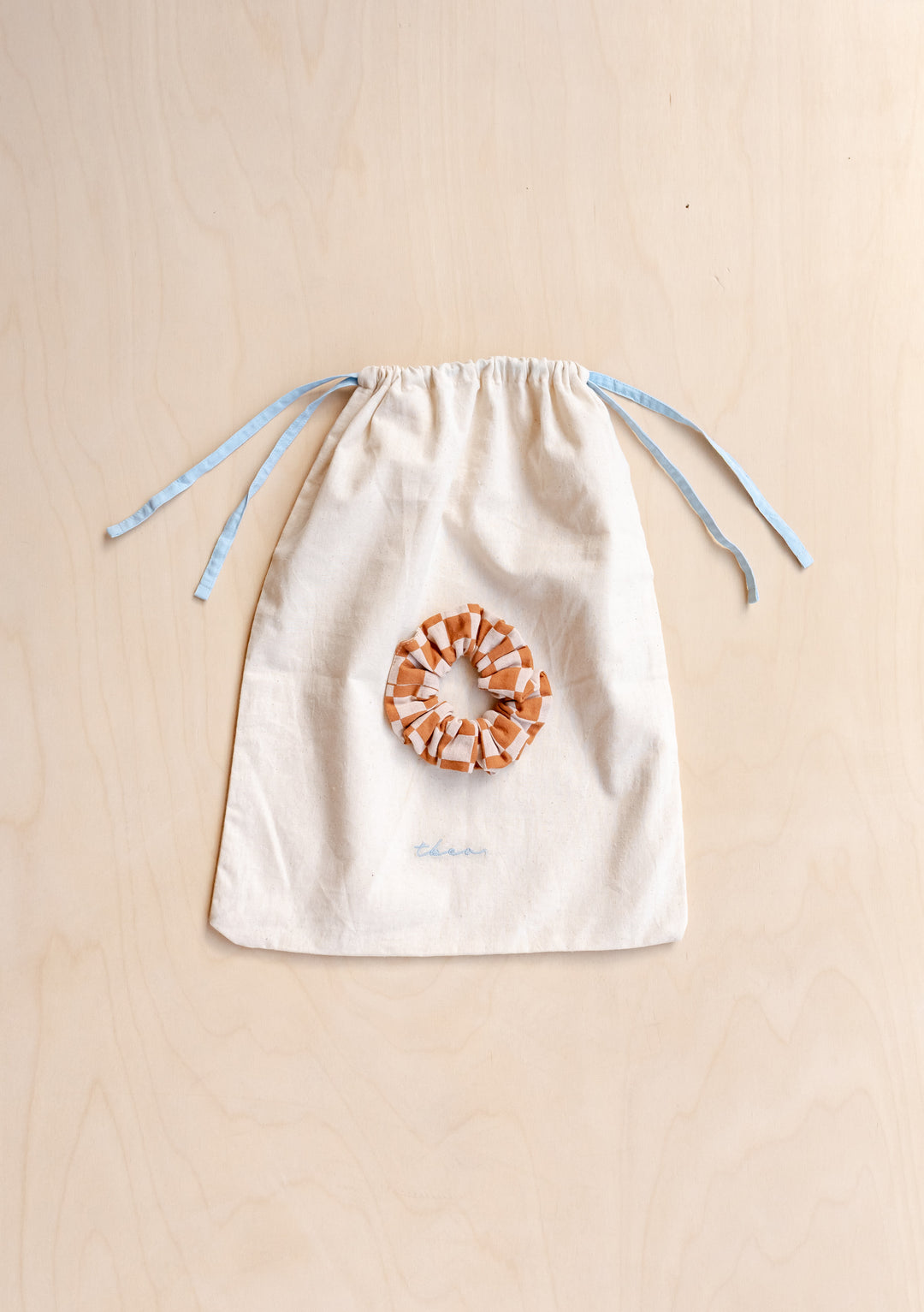 Cotton Pyjamas in Honey Checkerboard by TBCo includes matching scrunchie and cotton drawstring storage bag.