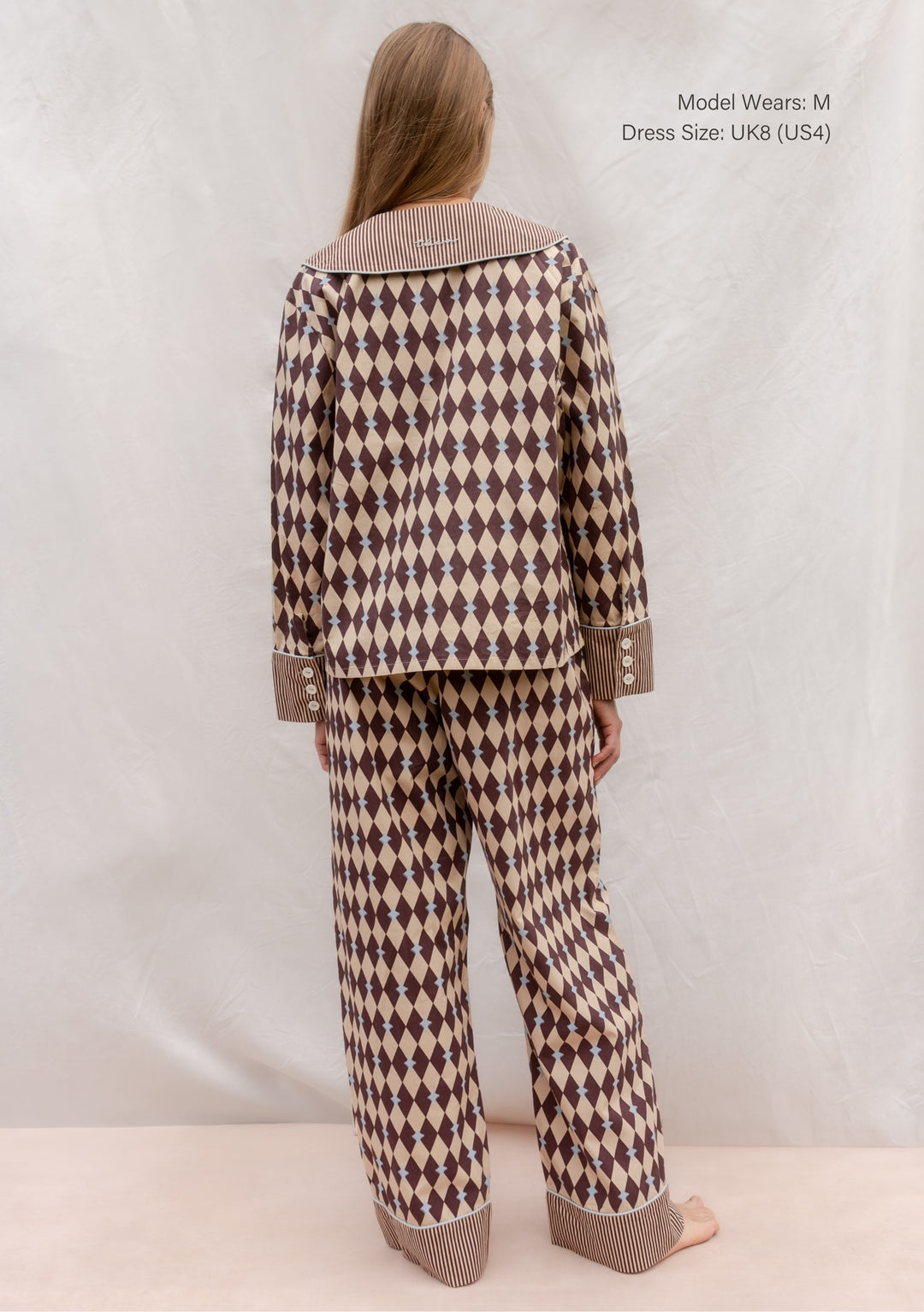 Back view of TBCo Cotton Pyjamas in Camel Harlequin with blue piping and striped oversized collar and cuffs.