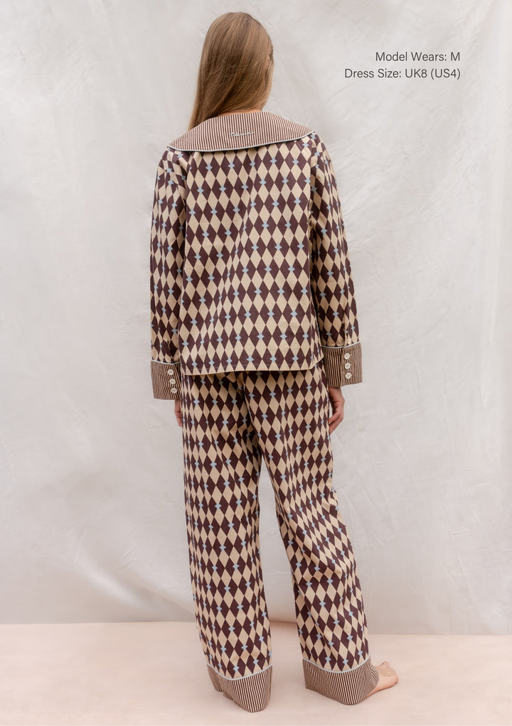 Back view of TBCo Cotton Pyjamas in Camel Harlequin with blue piping and striped oversized collar and cuffs.