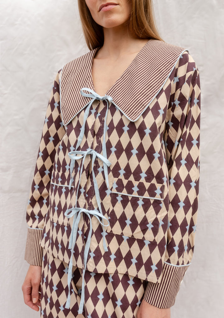 Cotton Pyjamas in Camel Harlequin by TBCo with breathable cotton, blue bows, striped collar, and pockets for everyday comfort.