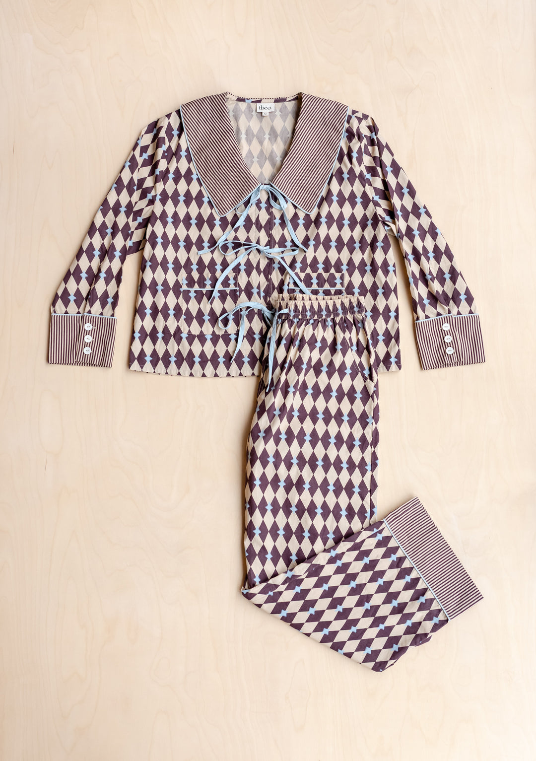 Cotton Pyjamas in Camel Harlequin by TBCo featuring breathable cotton with camel and burgundy diamond pattern and blue bows.