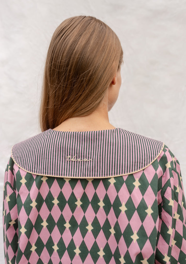 Back view of TBCo Cotton Pyjamas in Pink Harlequin featuring embroidered collar and diamond pattern.
