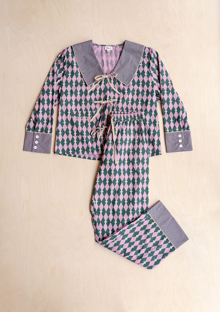 Cotton Pyjamas in Pink Harlequin by TBCo with breathable cotton, contrasting camel bows, striped collar, and elastic waistband.