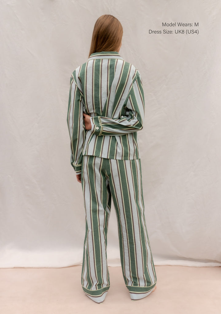 Back view of TBCo Cotton Pyjamas in Blue Stripe worn by model, featuring breathable cotton and tailored fit.