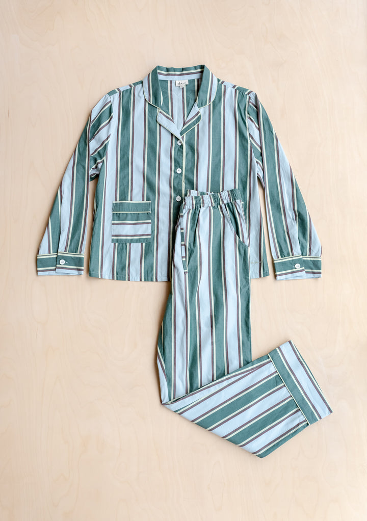 Cotton Pyjamas in Blue Stripe by TBCo, breathable cotton with classic blue and green stripes, elastic waistband, and contrast buttons.