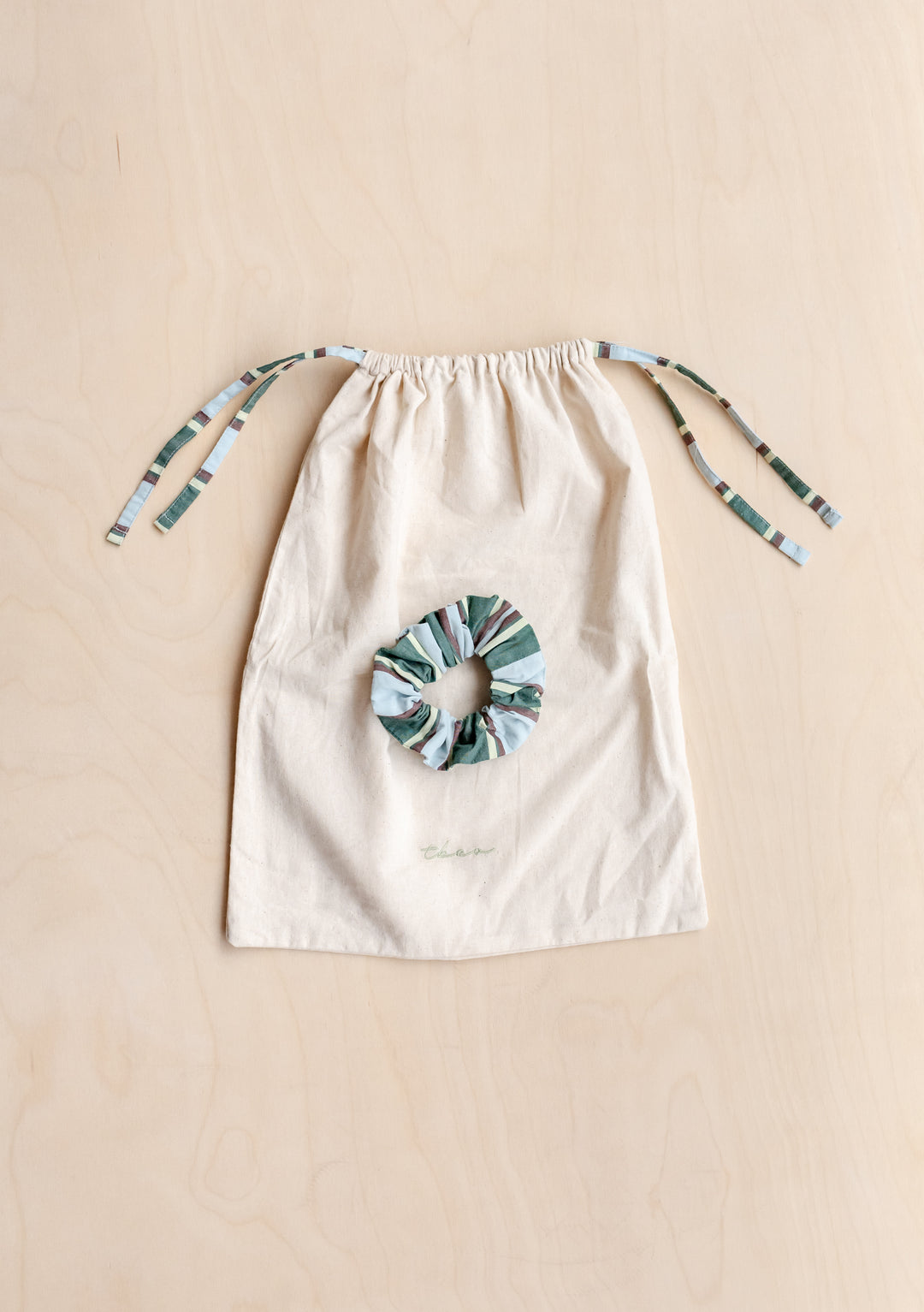 Cotton Pyjamas in Blue Stripe by TBCo includes matching scrunchie and cotton drawstring bag for easy storage and travel.