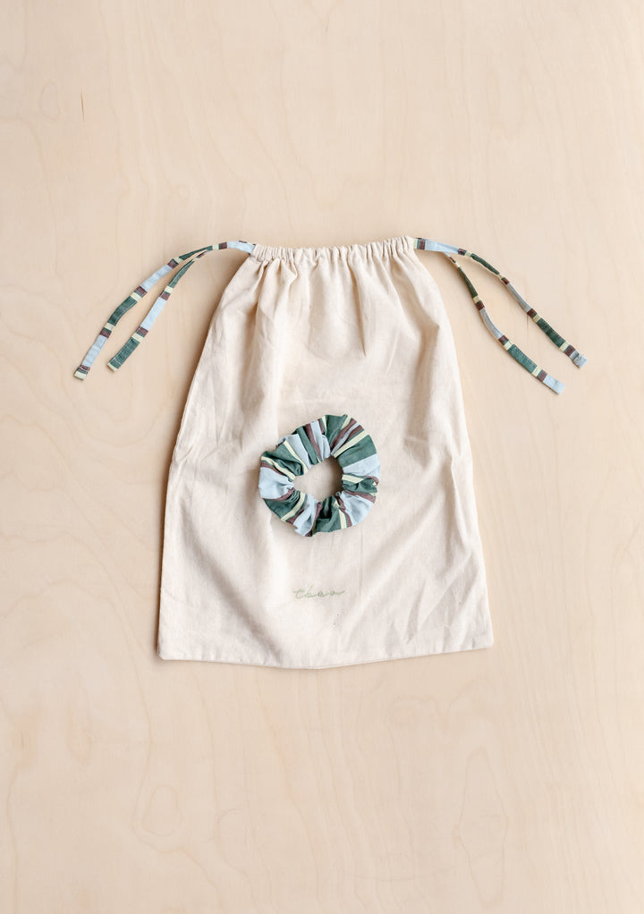 Cotton Pyjamas in Blue Stripe by TBCo includes matching scrunchie and cotton drawstring bag for easy storage and travel.