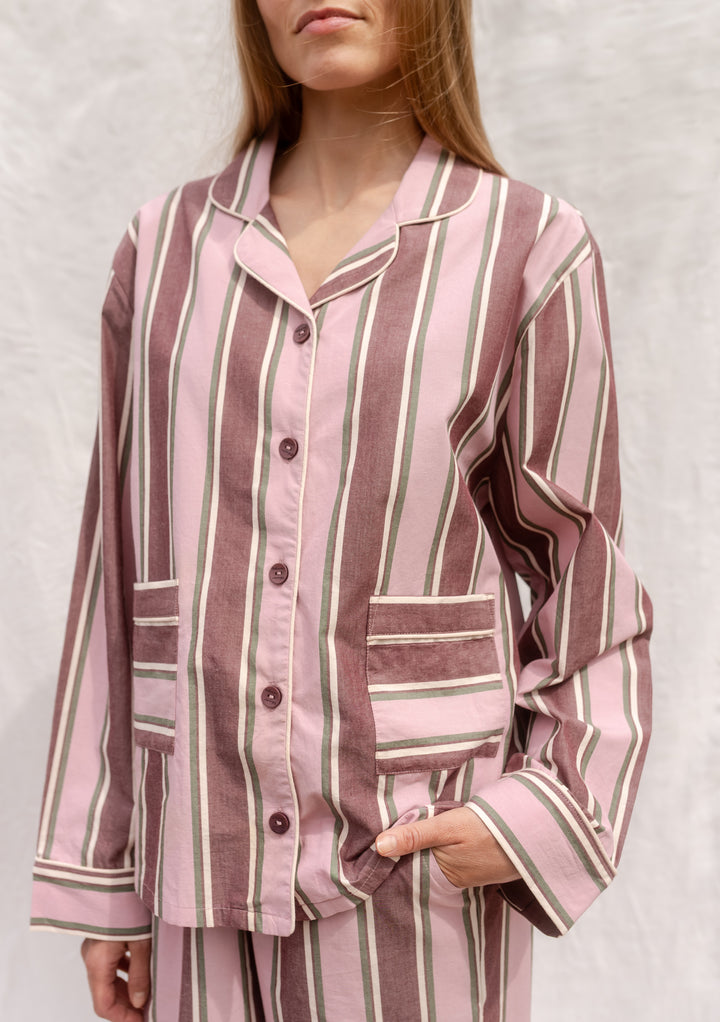 Cotton Pyjamas in Pink Stripe by TBCo, breathable cotton with pink and burgundy stripes, buttons, pockets, and elastic waistband.