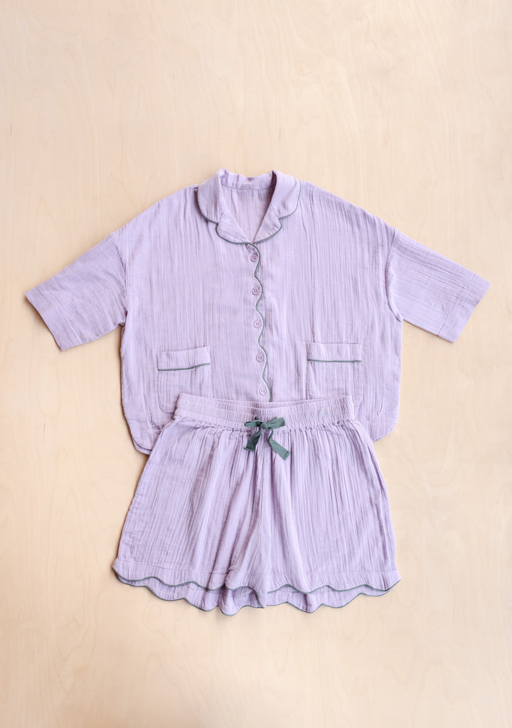 Cotton Pyjamas in Lilac by TBCo laid flat showing soft fabric and green trimmed drawstring in gallery position 5 portrait view