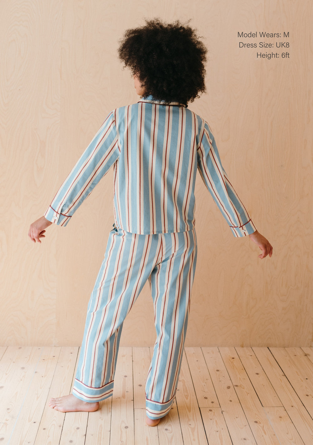 Back view of TBCo Cotton Pyjamas in Blue Stripe with red and cream stripes, showing tailored fit and piped detailing