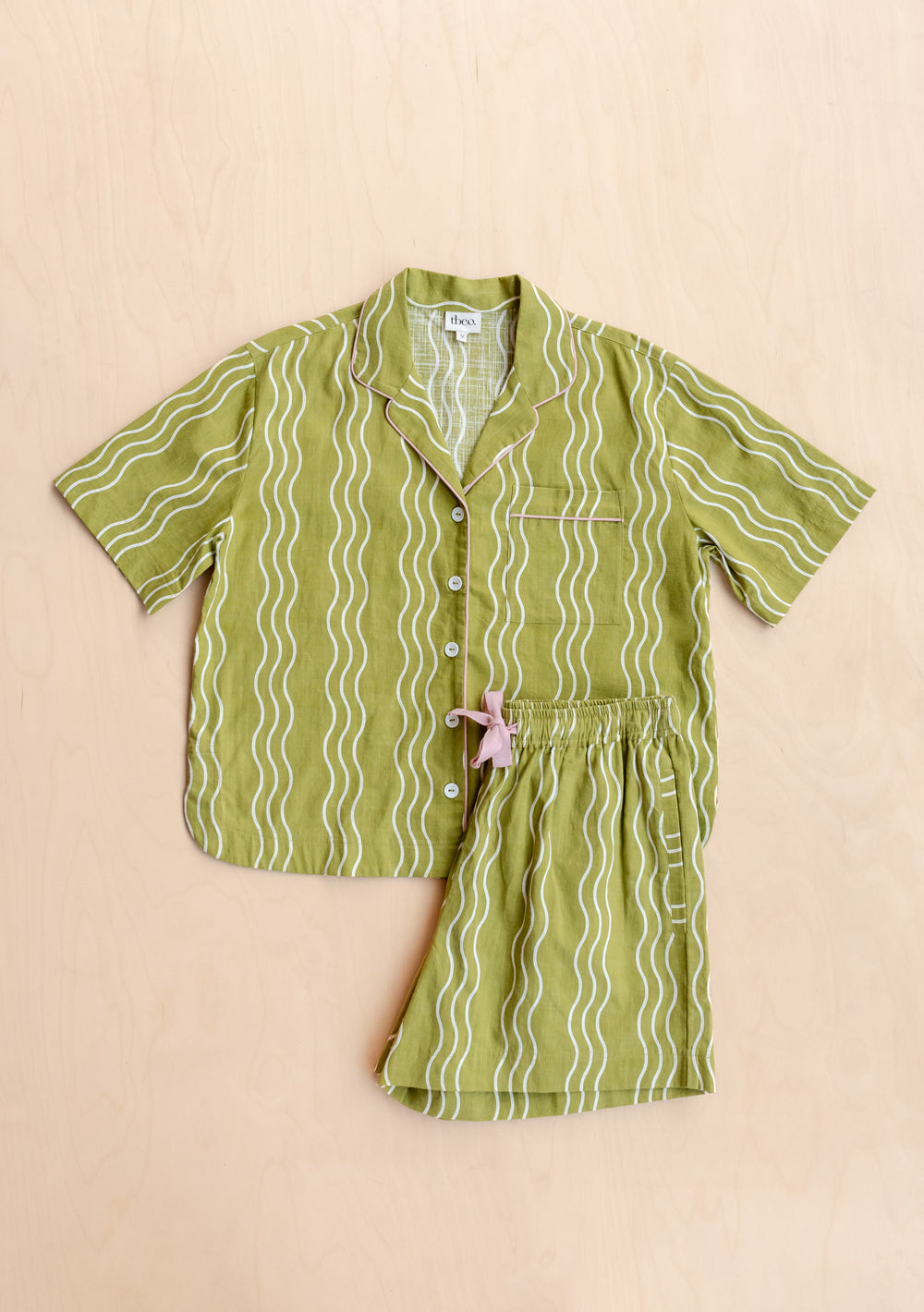 Cotton Pyjamas in Olive Wave from TBCo featuring collared top and shorts with cream wavy stripes on green cotton fabric